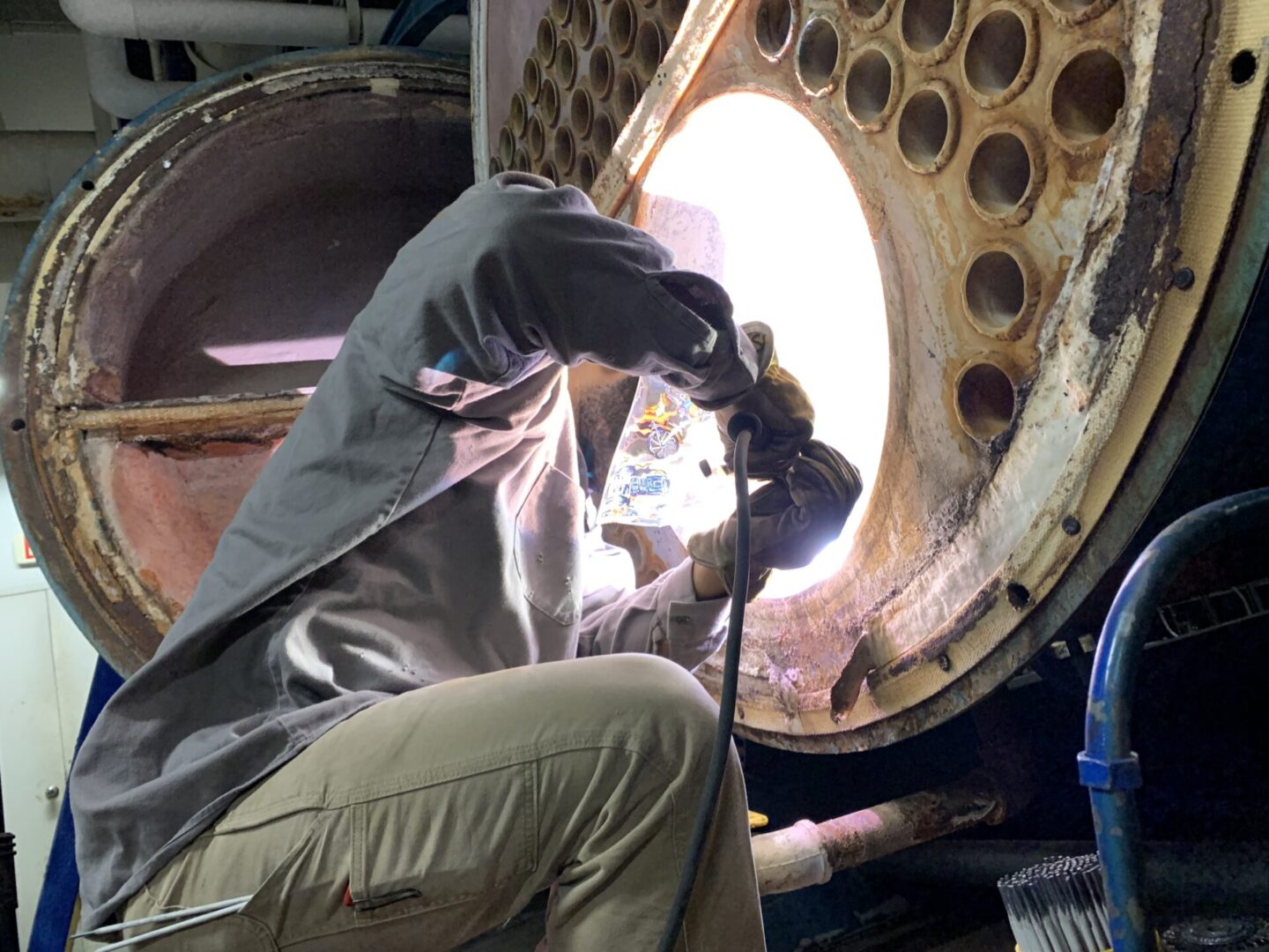Certified welder performing R-stamp pressure vessel repair