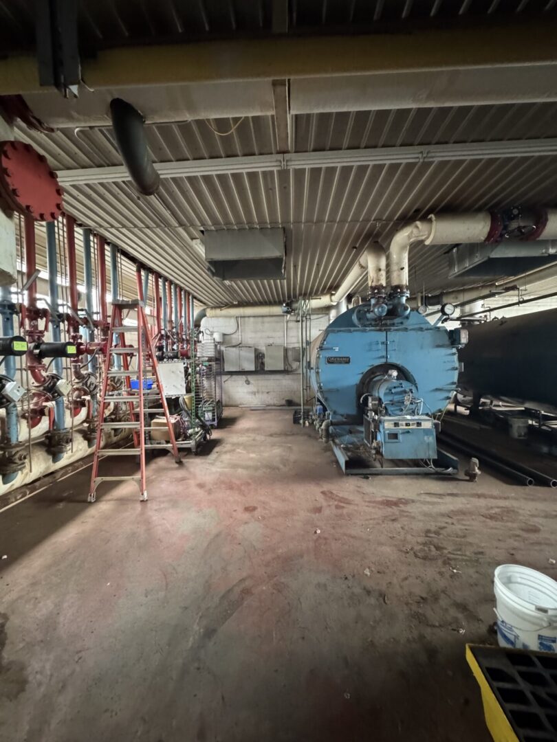 Commercial boiler room with upgraded pumps and replacement valves installed during mechanical system modernization project